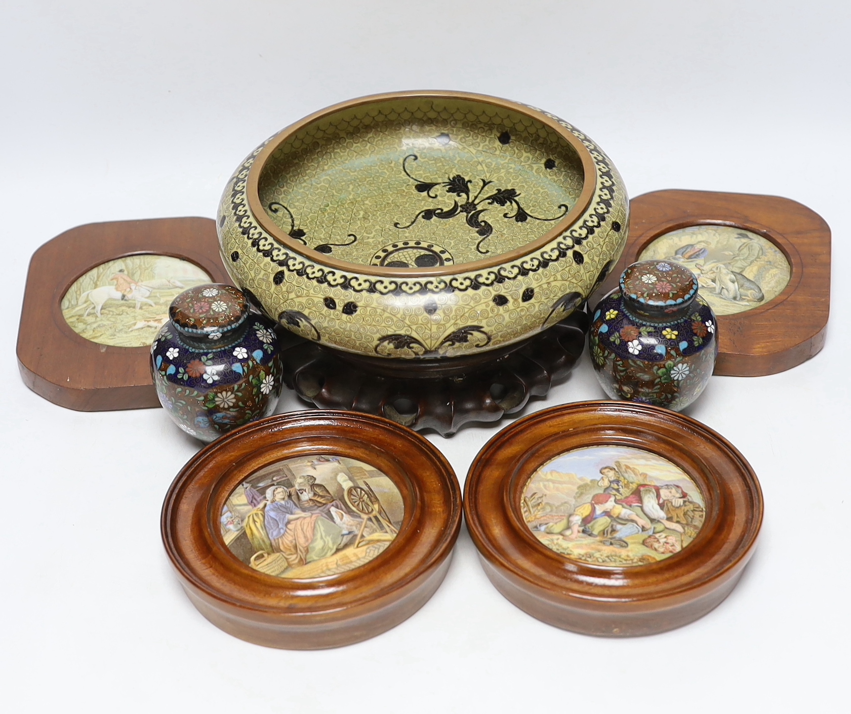 A Chinese cloisonné enamel bowl on a wooden stand, a pair of cloisonné jars with covers, and four 19th century Prattware pot lids, largest 25cm in diameter